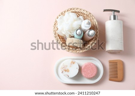 Bath accessories. Flat lay composition with personal care products on pink background, space for text