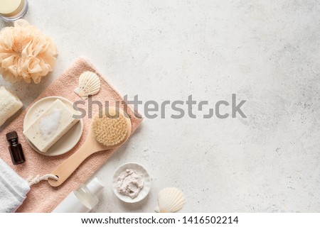 Bath Accessories on white stone background, top view, copy space. Daily bodycare concept, organic bath products.
