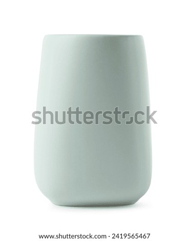 Bath accessory. Light green ceramic toothbrush holder isolated on white