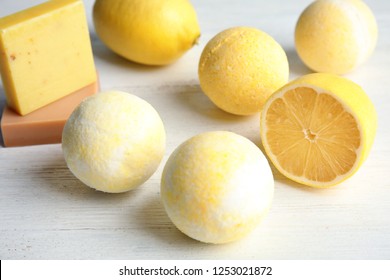 Bath Bombs And Lemon On White Wooden Background