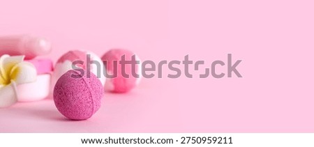 Bath bombs on pink background with space for text, closeup