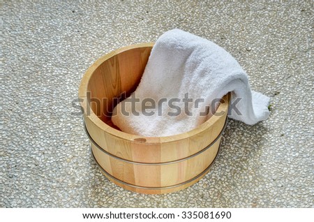 Bath bucket with a towel  in bathroom  