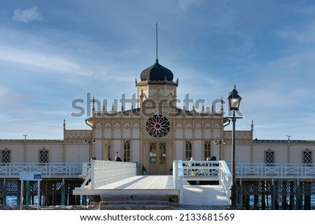 Bath house on piles in the ocean in Varberg (Sweden). Classical moresque building at the sandy beach, tourist attraction, tourism, exotic and beautiful building with special architecture, background