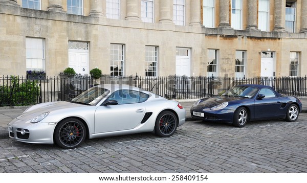 BATH\
- JUL 26: View of Porsche sports cars parked on the landmark Royal\
Crescent on Jul 26, 2010 in Bath, UK. Bath is a UNESCO World\
Heritage city with over 4 million visitors per\
year.