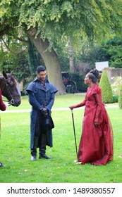 Bath, Bath And North East Somerset / United Kingdom - 27th August 2019: Regé-Jean Page And Adjoa Andoh In A Filming For The Netflix Series Bridgerton, Using The Holburne Museum As The Set