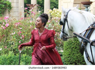 Bath, Bath And North East Somerset / United Kingdom - 27th August 2019: Adjoa Andoh In A Filming For The Netflix Series Bridgerton, Using The Holburne Museum As The Set