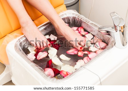 bath with rose petals in pedicure