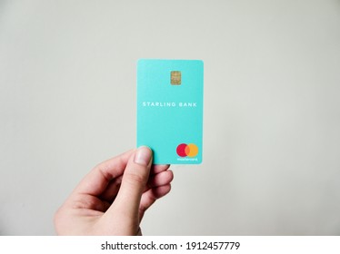 Bath, Somerset. United Kingdom. February 8 2021: Starling Bank Card Being Held In Hand. One Of The First Virtual Banks In The UK Market. The Best Travel Money Card Due To Multi-currency Account.