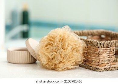 Bath Sponge, Basket And Jar On Table In Bathroom, Closeup