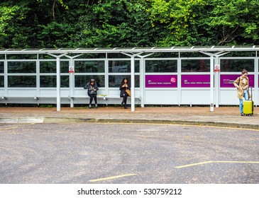 BATH, UK - CIRCA SEPTEMBER 2016: HDR Students Waiting For Transport At Bath University Bus Station