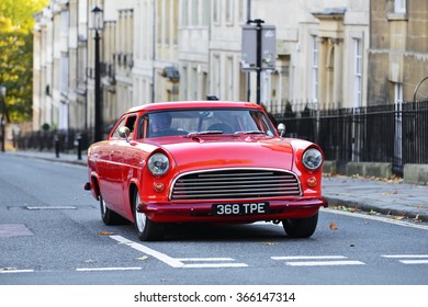 BATH, UK - OCT 18, 2014: A Motorist Drives A Highly Modified Classic Muscle Car On A City Centre Road.