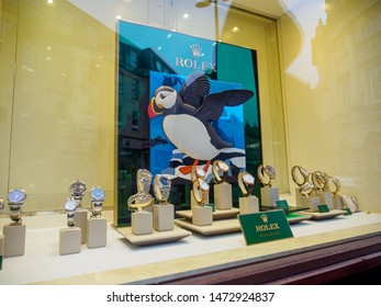 BATH, UNITED KINGDOM - MARCH 5, 2019: Wide Angle View Of The Rolex Plaque Next To Multiple Gold Datejust, Cellini, And Day-Date Watches At A Boutique Display. Luxury Swiss Timepiece Industry.