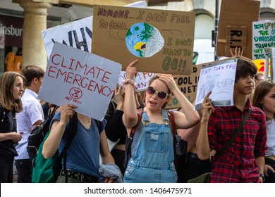 Bath, United Kingdom - May 24 2019: Young Girl At Youth Strike For Climate Action Protest Holding A Sign Referencing The Marvel Avengers Films.