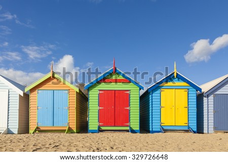 Bathing boxes in a beach against blue sky with copyspace