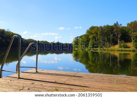 Bathing jetty on Huwenow lake in meseberg in autumn, federal state Brandenburg - Germany