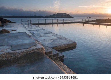 The Bathing pools and Castle Cornet in the background, St. Peters Port, Guernsey, Channel Islands, United Kingdom, Europe