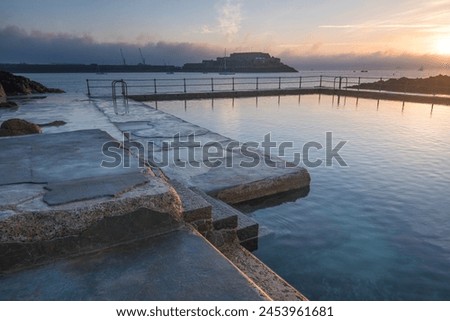 The Bathing pools and Castle Cornet in the background, St. Peters Port, Guernsey, Channel Islands, United Kingdom, Europe