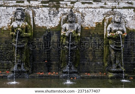 Bathing temple figures Goa gajah Bali Indonesia 