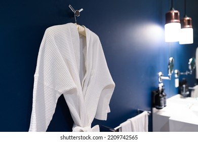 Bathrobe Hanging On Blue Wall