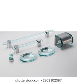 Bathroom accessory set, made of thick cut glass and chrome-plated metal. Includes towel rack, soap dish, and toilet paper holder.