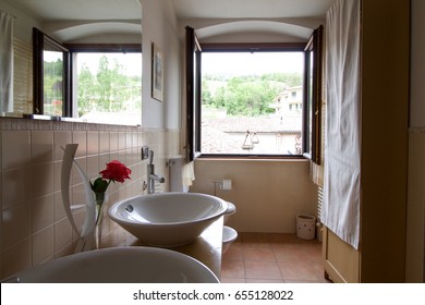 Bathroom In Country House With Open Window Reflected In The Mirror