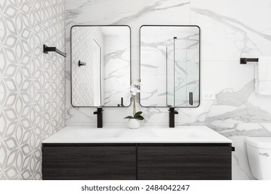 A bathroom detail with a modern wood cabinet, pattern and marble tiled walls, a white sink and black faucets, and black framed mirrors. - Powered by Shutterstock