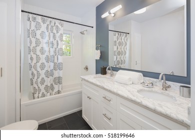 Bathroom With Double Oval Marble Sink And Shower Curtain. 