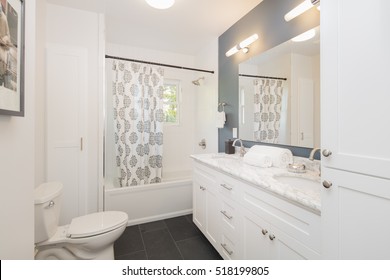 Bathroom With Double Oval Marble Sink And Shower Curtain. 