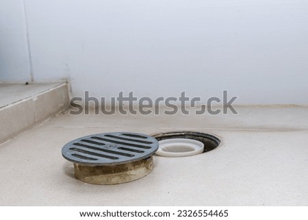Bathroom floor drain and cover, drain cleaning, sewage. 