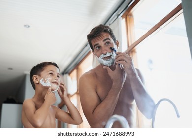 Bathroom, hair removal and father shaving with kid for hygiene, grooming and health routine. Bonding, child development and boy learning razor facial epilation treatment with man for skincare at home - Powered by Shutterstock