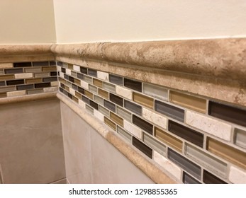 Bathroom Or Hallway Wall Decoration With Worm Tiles And Floor Tiling Design. Tile Backsplash Decor Installation In Family Home. Glass And Soil Tiles Selection.