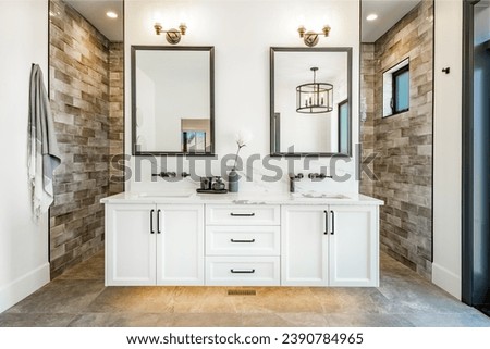 Bathroom interior with glass wall shower claw footed tub oval bathtub shiny black and tile floors mirrors bright lighting decor of flowers houseplants spacious and luxurious restroom
