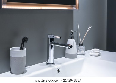 Bathroom interior with sink and faucet.