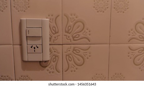 Bathroom Light Switch On The Wall Of Tiles