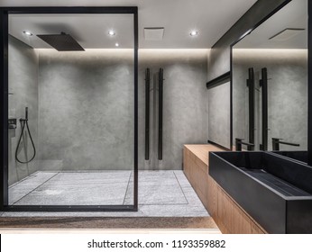 Bathroom in a modern style with gray tiled walls. There is a shower with a glass partition, wooden stand with a black sink and a faucet, large mirror, luminous lamps. Horizontal. - Shutterstock ID 1193359882