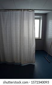 Bathroom With Old Shower Curtain In Hospital.