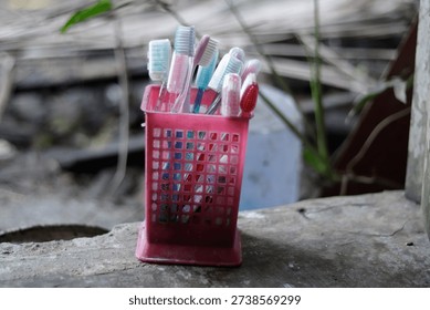 A bathroom rack for holding toothbrushes and toothpaste. The image represents personal hygiene, daily routine, and clean bathroom organization.