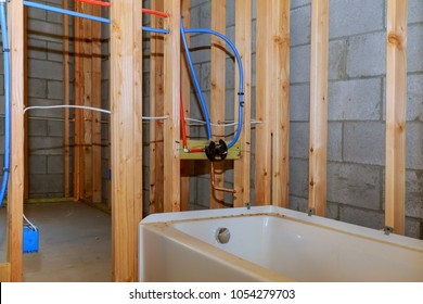 Bathroom Remodel Showing Under Floor Plumbing Work Connecting Installation Of Pipes For Water For New Buildings