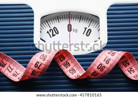 Bathroom scale with measuring tape on white background. Weight loss concept