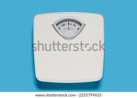 Bathroom scale on light blue background, top view Сток-фото © 