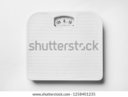 Bathroom scales on white background, top view. Weight loss concept