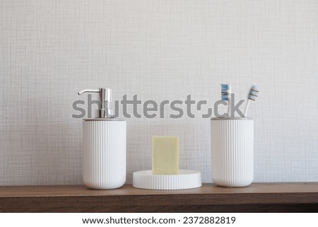 bathroom soap dispenser and toothbrush cup