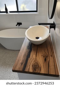 Bathroom with timber top vanity