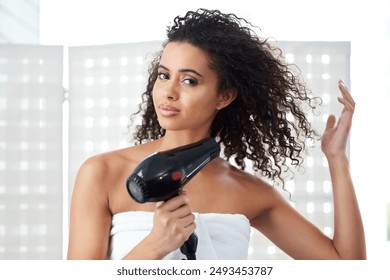 Bathroom, towel and portrait of woman with hairdryer for shampoo, treatment or morning routine. Home, female person and confident with electrical appliance for hair care, texture or styling with heat - Powered by Shutterstock