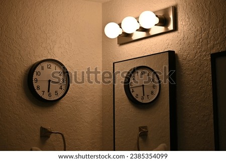 Bathroom vanity with clock reflection 