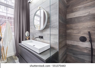 Bathroom with walk in shower and white countertop basin