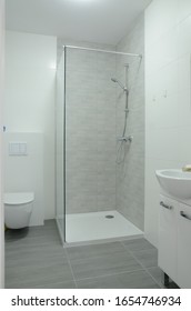 Bathroom With Walk-in Shower In New Apartment In Wroclaw, Poland. Studio Type Apartment With Area Of 31 Sqm.