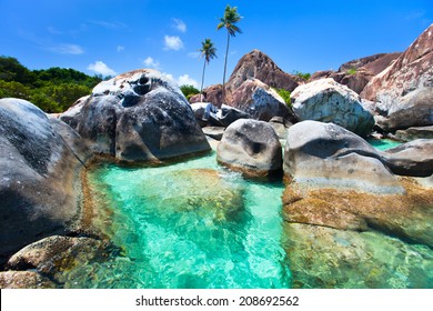 The Baths Beach Area Major Tourist Attraction At Virgin Gorda, British Virgin Islands With Turquoise Water And Huge Granite Boulders