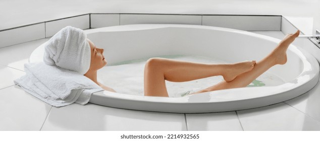 Bathtime. Taking a bath. Profile portrait of young woman is  chilling in jaccuzi at home or hotel.  Web banner 