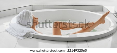 Bathtime. Taking a bath. Profile portrait of young woman is  chilling in jaccuzi at home or hotel.  Web banner 